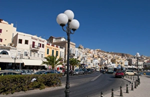 Hermoupolis, Syros Island, Greece. Main street shops and traffic Hermoupolis, Syros Island, Greece. Main street shops and traffic