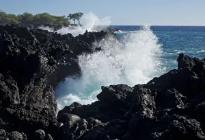 Huge waves crashing against lava rocks on coast of Big Island, Hawaii Huge waves crashing against lava rocks on coast of Big Island, Hawaii