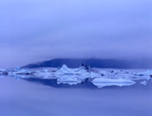 Iceberg, reflection & low clouds. Russell Fiord Wilderness Tongass National Forest Iceberg, reflection & low clouds. Russell Fiord Wilderness Tongass National Forest