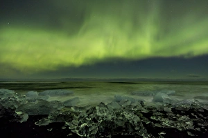 Iceland, Jokulsarlon. Aurora borealis and ocean shore Iceland, Jokulsarlon. Aurora borealis and ocean shore