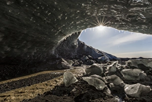 Iceland. Sunburst at ice cave entrance. Credit as: Bill Young / Jaynes Gallery Iceland. Sunburst at ice cave entrance. Credit as: Bill Young / Jaynes Gallery