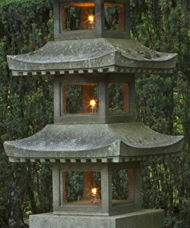 Illuminated stone pagoda lantern in Portland Japanese Garden Illuminated stone pagoda lantern in Portland Japanese Garden