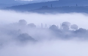 Italy, Tuscany, Pienza. Morning fog over town Italy, Tuscany, Pienza. Morning fog over town