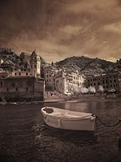 Italy, Vernazza. Infrared image of a boat in the harbor of Vernazza with the church in Italy, Vernazza. Infrared image of a boat in the harbor of Vernazza with the church in