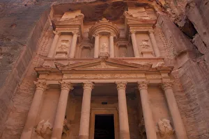 Jordan, Petra. Looking up at the massive face of the Treasury which was cut out of Jordan, Petra. Looking up at the massive face of the Treasury which was cut out of