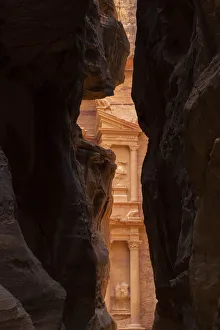 Jordan, Petra. Looking thru the narrow canyon leading towards the face of the Treasury Jordan, Petra. Looking thru the narrow canyon leading towards the face of the Treasury