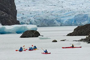 Kayakers exploring Grey Lake and Grey Glacier, Torres del Paine National Park Kayakers exploring Grey Lake and Grey Glacier, Torres del Paine National Park