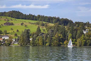 Lake Lucerne, Switzerland. Sailboat sailing on lake Lake Lucerne, Switzerland. Sailboat sailing on lake