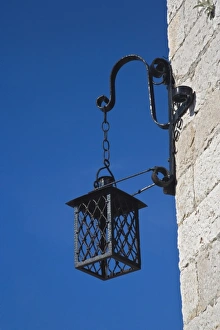 Lamp hanging at corner of building, Hvar Island, Croatia Lamp hanging at corner of building, Hvar Island, Croatia