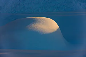 Landscape of snow mound at sunset, Haines, Alaska, USA Landscape of snow mound at sunset, Haines, Alaska, USA