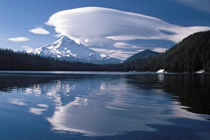 Large lenticular cloud hanging over Mt. Hood reflected in Lost Lake in the Oregon Large lenticular cloud hanging over Mt. Hood reflected in Lost Lake in the Oregon