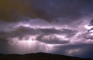 Lightning strikes during a thunderstorm on the first day of summer in Boise, Idaho, USA Lightning strikes during a thunderstorm on the first day of summer in Boise, Idaho, USA