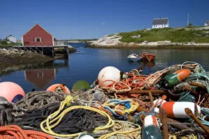 Lobster pots, buoys, and ropes on the dock at Peggys Cove, Nova Scotia, Canada Lobster pots, buoys, and ropes on the dock at Peggys Cove, Nova Scotia, Canada