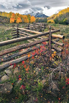 A log fence leads to the horizon on Dallas divide near Telluride in the Colorado Rocky A log fence leads to the horizon on Dallas divide near Telluride in the Colorado Rocky