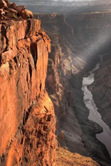 A lone ray of light filters through the clouds at sunrise at Toroweap Overlook in the A lone ray of light filters through the clouds at sunrise at Toroweap Overlook in the