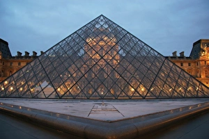 Louvre Museum. Facade of the building and glass pyramid designed by the architect Leo Louvre Museum. Facade of the building and glass pyramid designed by the architect Leo