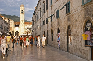 The main street Stradun Placa with traditional houses, view over clock tower The main street Stradun Placa with traditional houses, view over clock tower
