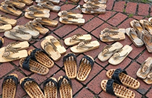 Malacca City, Malaysia, UNESCO Heritage City. Graphic pattern of shoes on floor Malacca City, Malaysia, UNESCO Heritage City. Graphic pattern of shoes on floor
