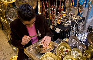 Man pounding metal plates in streets of the Medina area of Tunis Tunisia of Northern Man pounding metal plates in streets of the Medina area of Tunis Tunisia of Northern
