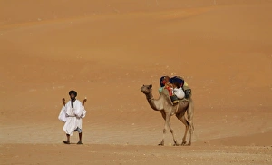 Mauritania, Route Espoir, Boutuilimit, A man with his dromedary Mauritania, Route Espoir, Boutuilimit, A man with his dromedary