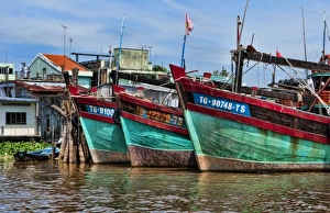 Mekong Delta. A row of fishing boats below Ho Chi Minh City (Saigon), Vietnam Mekong Delta. A row of fishing boats below Ho Chi Minh City (Saigon), Vietnam