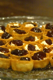 Mini bouchees canapees croustades filo tartlets filled with French goat cheese chevre Mini bouchees canapees croustades filo tartlets filled with French goat cheese chevre