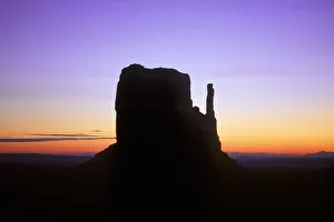 Mitten Butte silhouetted against dawn sky, Monument Valley Navajo Tribal Park, Arizona, USA Mitten Butte silhouetted against dawn sky, Monument Valley Navajo Tribal Park, Arizona, USA