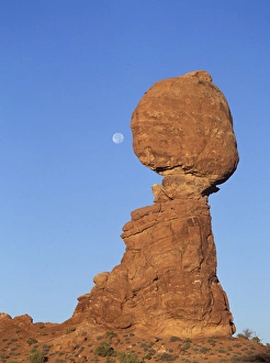 Full moon descending above Balancing Rock in Arches National Park, Utah Full moon descending above Balancing Rock in Arches National Park, Utah