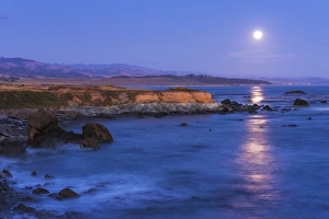 Full moon rising over Piedras Blancas elephant seal rookery, San Simeon, California USA Full moon rising over Piedras Blancas elephant seal rookery, San Simeon, California USA