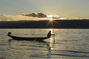 Myanmar, Inle Lake. Fisherman at sunset on Inle Lake Myanmar, Inle Lake. Fisherman at sunset on Inle Lake