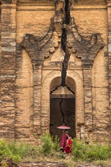 Myanmar, Mingun. Two novice Buddhist monks in front of temple entrance. Credit as Myanmar, Mingun. Two novice Buddhist monks in front of temple entrance. Credit as