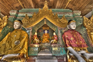 Myanmar, Yangon. Buddha statues in Schwedagon Temple Myanmar, Yangon. Buddha statues in Schwedagon Temple