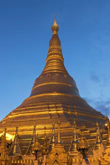 Myanmar, Yangon. A golden stupa at Shwedagon Pagodo, at twilight Myanmar, Yangon. A golden stupa at Shwedagon Pagodo, at twilight