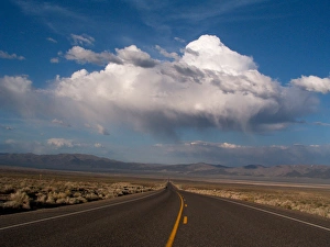 NEVADA. USA. Cumulus clouds over US Highway 50. The Loneliest Road in America" NEVADA. USA. Cumulus clouds over US Highway 50. The Loneliest Road in America"