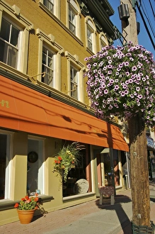 North America, Canada, Quebec, Eastern Townships, Magog. A sunlit street in downtown North America, Canada, Quebec, Eastern Townships, Magog. A sunlit street in downtown
