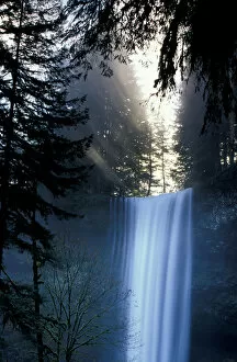 Images Dated 10th October 2005: North America, USA, Washington. Waterfall with rays of light shining through mist