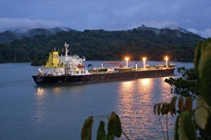 Panama, Panama Canal, ship in Panama Canal, rainforest in the background Panama, Panama Canal, ship in Panama Canal, rainforest in the background