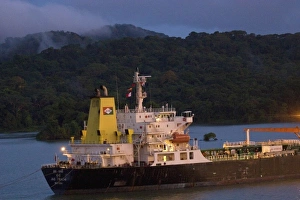 Panama, Panama Canal, ship in Panama Canal, rainforest in the background Panama, Panama Canal, ship in Panama Canal, rainforest in the background
