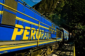 Passenger trains run right down the main street of the small village of Aguas Calientes Passenger trains run right down the main street of the small village of Aguas Calientes