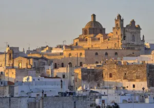 The picturesque old town of Ostuni in southern Italy, built on top of a hill and crowned The picturesque old town of Ostuni in southern Italy, built on top of a hill and crowned