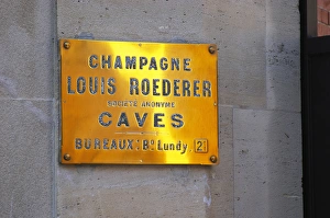 A polished brass sign at the winery of Louis Roederer saying cave (the wine cellar) A polished brass sign at the winery of Louis Roederer saying cave (the wine cellar)