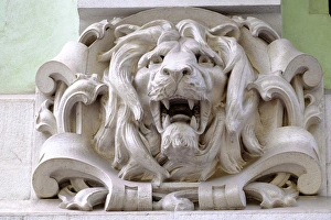 Portugal, Lisbon. Pombaline district, stone faces and animal heads adorn pastel colored Portugal, Lisbon. Pombaline district, stone faces and animal heads adorn pastel colored