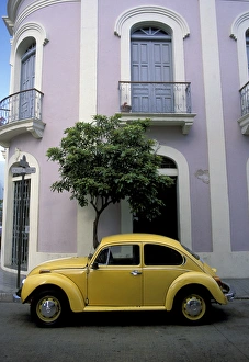 Puerto Rico, Ponce, Historic District. 19th century pink and white house with yellow Puerto Rico, Ponce, Historic District. 19th century pink and white house with yellow