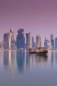 Qatar, Doha, Dhows on Doha Bay with West Bay skyscrapers, dawn Qatar, Doha, Dhows on Doha Bay with West Bay skyscrapers, dawn