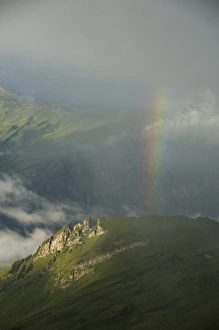 Rainbow over slopes below Faulhorn, Bernese Oberland, Switzerland ALPS Rainbow over slopes below Faulhorn, Bernese Oberland, Switzerland ALPS