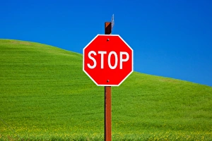 Red Stop Sign Green Wheat Grass Fields Blue Skies Abstract Palouse Washington State Red Stop Sign Green Wheat Grass Fields Blue Skies Abstract Palouse Washington State