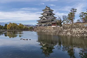 The reflection of the Matsumoto Castle and the castle against the mountain backdrop in The reflection of the Matsumoto Castle and the castle against the mountain backdrop in