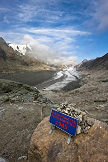 Retreat of Glacier Pasterze of Mount Grossglockner with a sign showing the glacier position 1985 Retreat of Glacier Pasterze of Mount Grossglockner with a sign showing the glacier position 1985