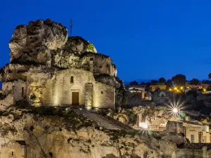The Roman Catholic church of Santa Maria de Idris, cut into the rock in Matera at night The Roman Catholic church of Santa Maria de Idris, cut into the rock in Matera at night