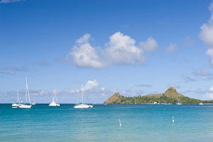Sailboats anchored off of Reduit beach on the island of St. Lucia in the southern Sailboats anchored off of Reduit beach on the island of St. Lucia in the southern